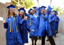 Cheerful graduates of Visions In Education